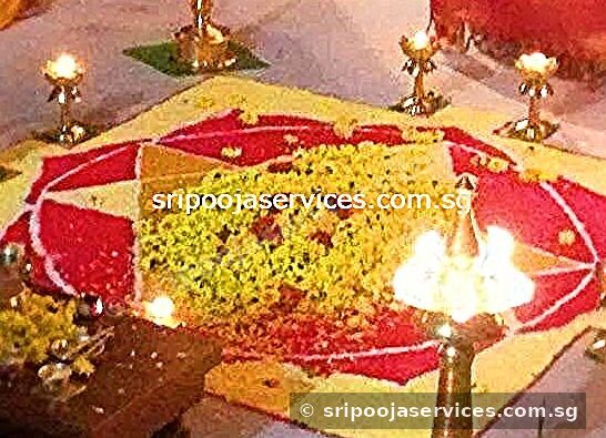 Floral kolam with lamps